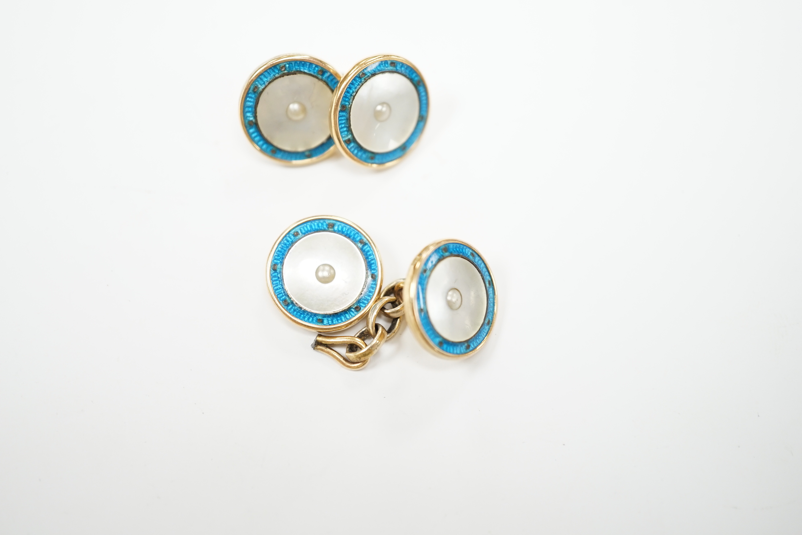 A pair of 9ct, mother of pearl and enamelled circular cufflinks, one link detached, 13mm, gross weight 6.5 grams.